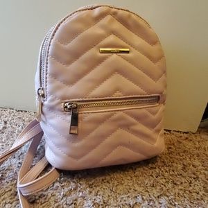 Pink purse backpack